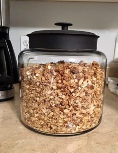A Very large glass jar of granola