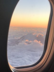 Sunset view of Mt. Rainier from a plane window