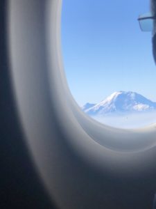 Morning view of Mt. Rainier from an airplane window.